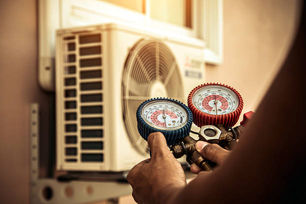 Professional Air Conditioning Service technician working in Kennard, IN